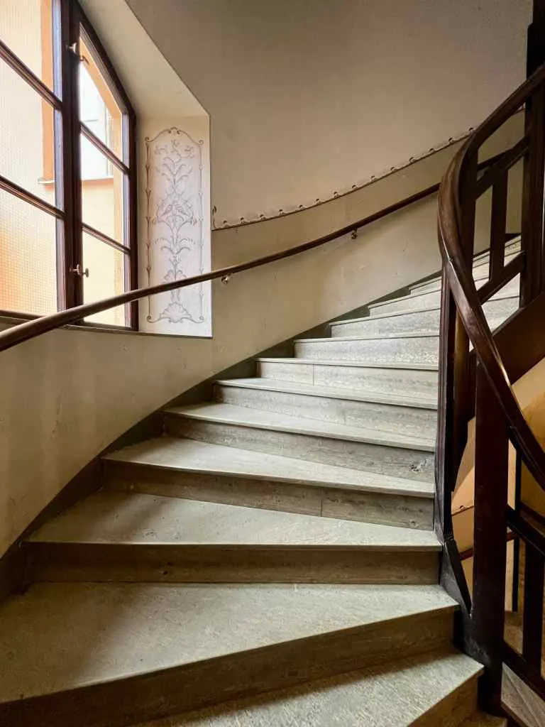 Wall decor and curved stairs of Swedish grace building